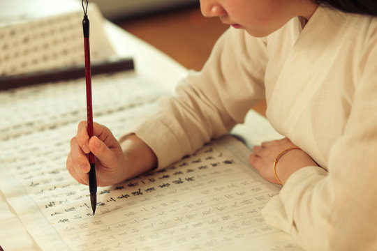 Young women in practice calligraphy