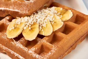 Belgian waffles with banana and kiwi./Dessert Belgian waffles with banana and kiwi.