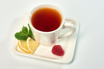 Raspberry tea./Tea with raspberries, lemon and mint. Hot drink.