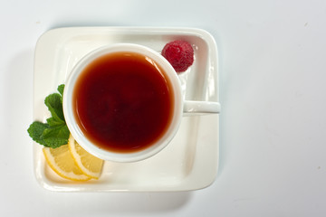 Raspberry tea./Tea with raspberries, lemon and mint. Hot drink.
