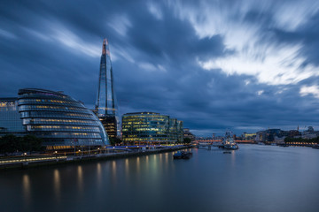 London's City Hall and the Shard with dramatic storm clouds