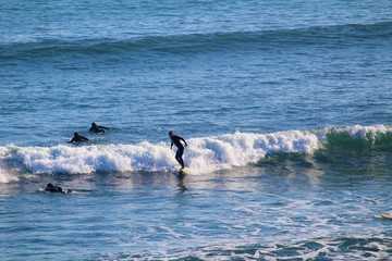 Surfer Standing on Wave at Beach on Phillip Island, Australia