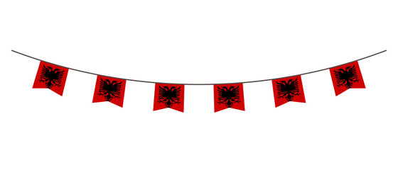 Fototapeta premium Bunting decoration in colors of Albania flag. Garland, pennants on a rope for party, carnival, festival, celebration. For National Day of Albania on August&nbsp;18