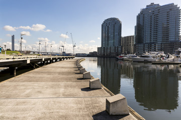 Docklands, Melbourne, Victoria, Australia. Waterfront buildings and marina, water and glass...