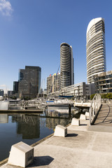 Docklands, Melbourne, Victoria, Australia. Waterfront buildings and marina, water and glass...