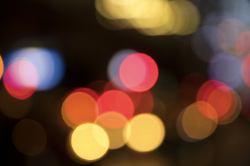 Blurry background image of defocused colorful lights at night