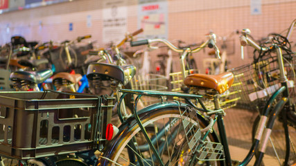 TOKYO, JAPAN - SEPTEMBER 8, 2018: One of many bicycle parking with several bicycles in a row in Asakusa district in Tokyo.