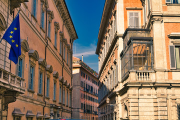 Fototapeta na wymiar Buildings seem to merge on narrow street in Rome, Italy