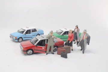 a model of taxi and small figures