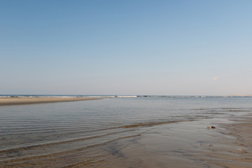 Tidal pool and waves on the Atlantic Ocean shore, Sunset Beach, North Carolina