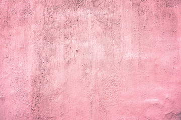 Pink dyed wall texture background. Plastered and dyed wall surface.