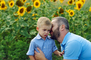 Frustrated, the son and the father . Father calms son for a walk