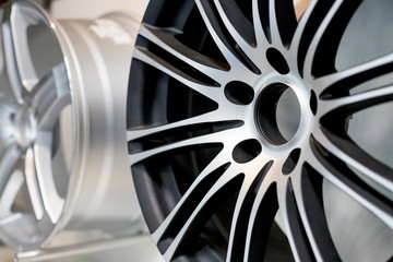 alloy wheels in wheel shop.Wheel rims on showcase. Car alloy wheels at a wheel shop or automobile...