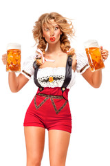 Oktoberfest / Creative concept photo of Oktoberfest waitress wearing a traditional Bavarian costume with beer isolated on white background.