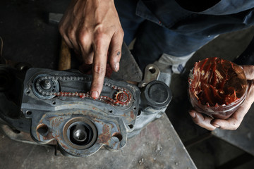 The mechanic serves the truck. Repair brake caliper. Close-up. Maintenance. Brake system. Brake...