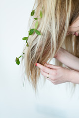 Naklejka premium harmony with nature. eco friendly sustainable lifestyle. natural hair products. blond girl wearing flowers in her updo.