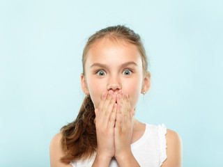 surprised shocked astonished amazed girl covering mouth with hand. unbelievable news. young cute...