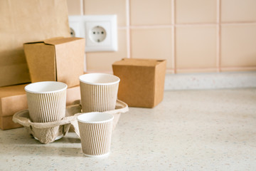 Food and drink craft packaging set on kitchen background, copy space