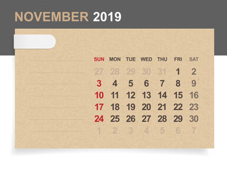 November 2019 - Monthly calendar on brown paper and wood background with area for note. Vector.