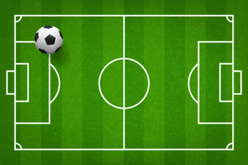 Soccer football ball on green grass of soccer field pattern background. Vector.