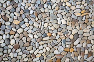 Colorful patterned surface of a stone wall.