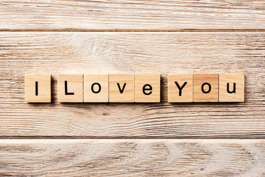 i love you word written on wood block. i love you text on table, concept