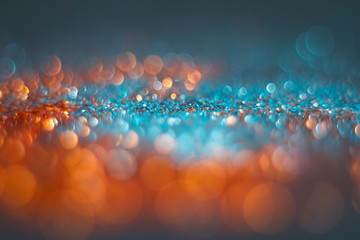 Abstraction orange bokeh on a blue background. Defocused. - Powered by Adobe