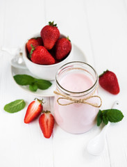 Jar with strawberry yogurt