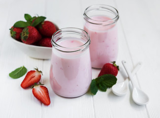 Jars with strawberry yogurt
