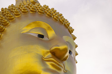 Big golden Buddha, Wat Muang Angthong popular Buddhist shrine in Thailand.