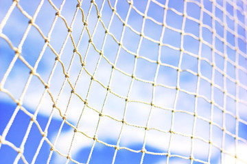 Mesh soccer outdoors. close-up. macro. football goal against the sky.