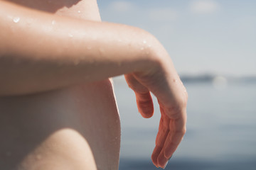 young girl in the boat on a sunny day detail shot of hand