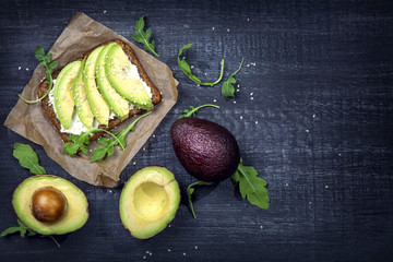 Sandwiches with rye bread and fresh sliced avocado