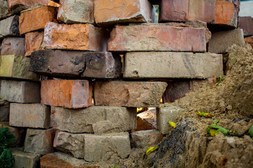 a pile of bricks on the backyard