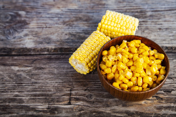 Raw corn and canned corn in a bowl