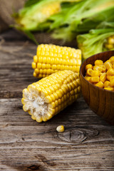 Raw corn and canned corn in a bowl