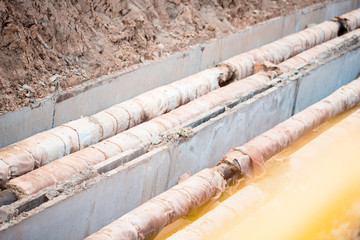 Water pipeline near footpath in the city.