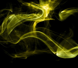 Yellow smoke on black background