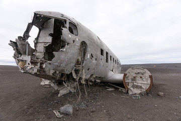 Fototapeta na wymiar Plane wreck in Iceland at a cloudy day with no people