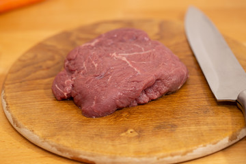 raw meat on cutting board