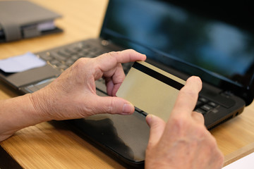 woman holding credit card using computer for online shopping. businesswoman purchase product from internet, make payment on bank website