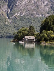 Fototapeta na wymiar Norway lake reflection house trees