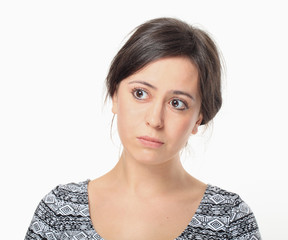 Upset young woman looking right