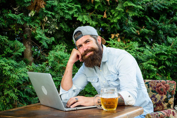 Brutal man leisure with beer and sport game. Football fan bearded hipster make bet sport game...