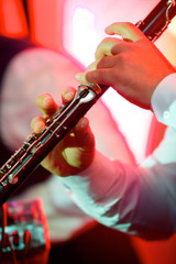 Fototapeta premium Musical instrument flute in the hands of a male musician.
