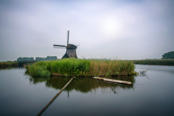 Old dutch windmill in cold morning scenery