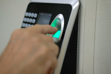 hand scanning finger print on access control machine. hour work time recording & security