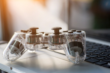 Video game controller isolated on the laptop.