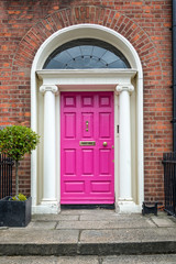 Pink classic door in Dublin, example of georgian typical architecture of Dublin, Ireland