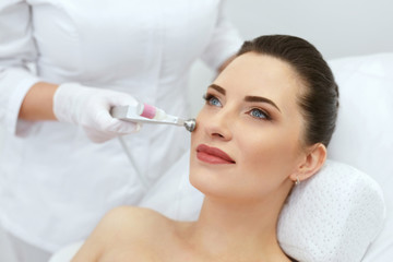 Beauty Clinic. Woman Doing Face Skin Cryo Oxygen Treatment